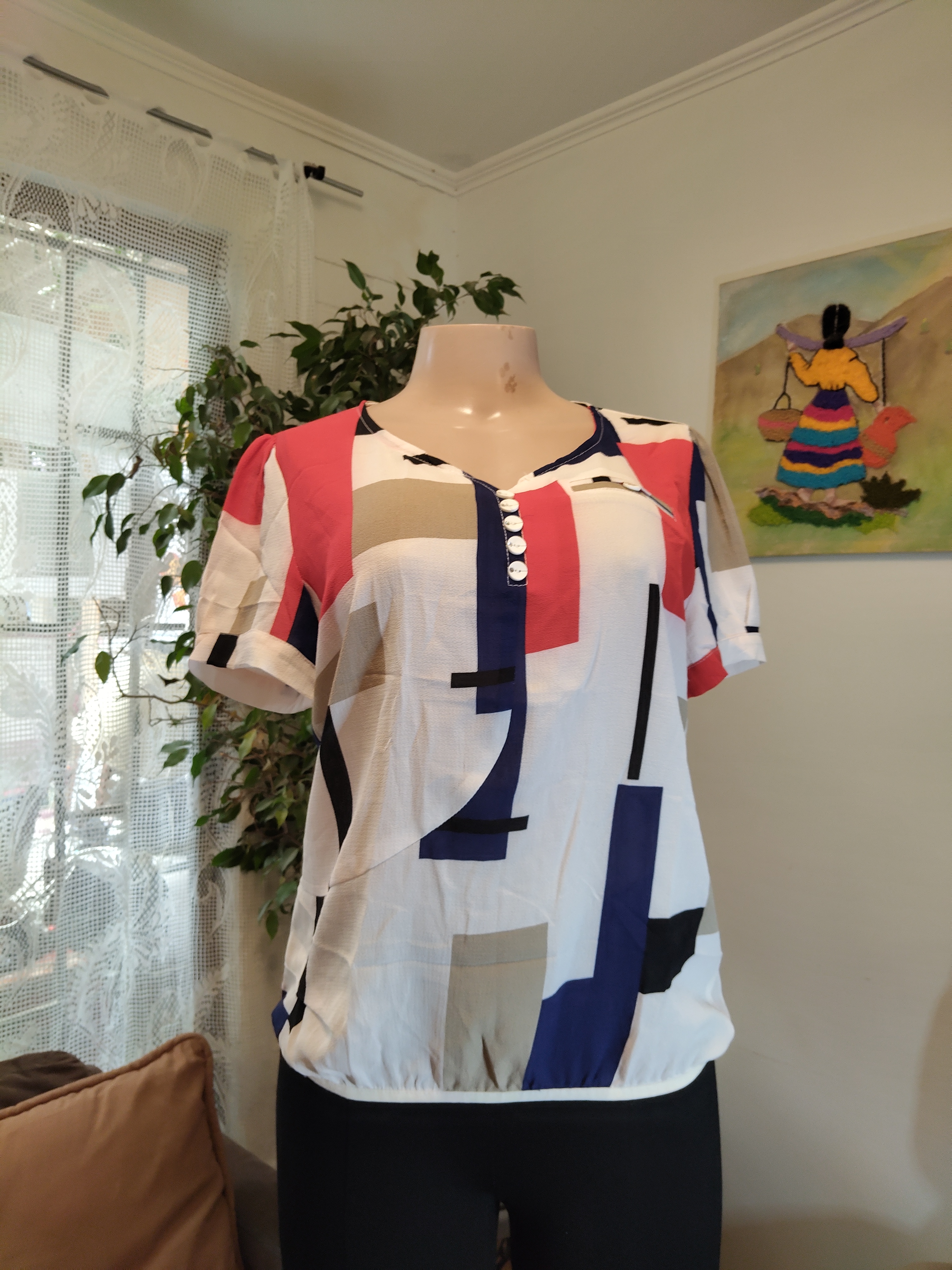 Blusa geométrica abstracta blanca